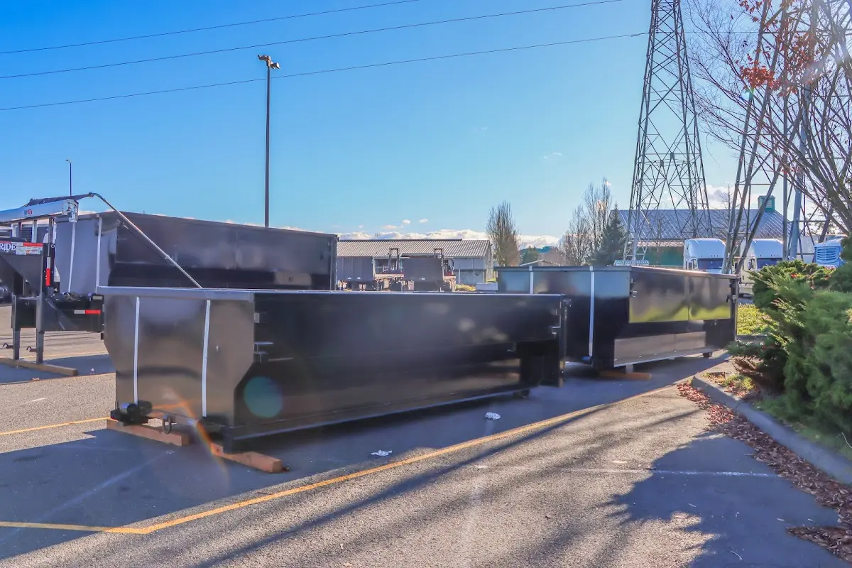 Roll-off dumpster ready for waste disposal at job site for 15 Yard Dumpster Rental in Bellevue